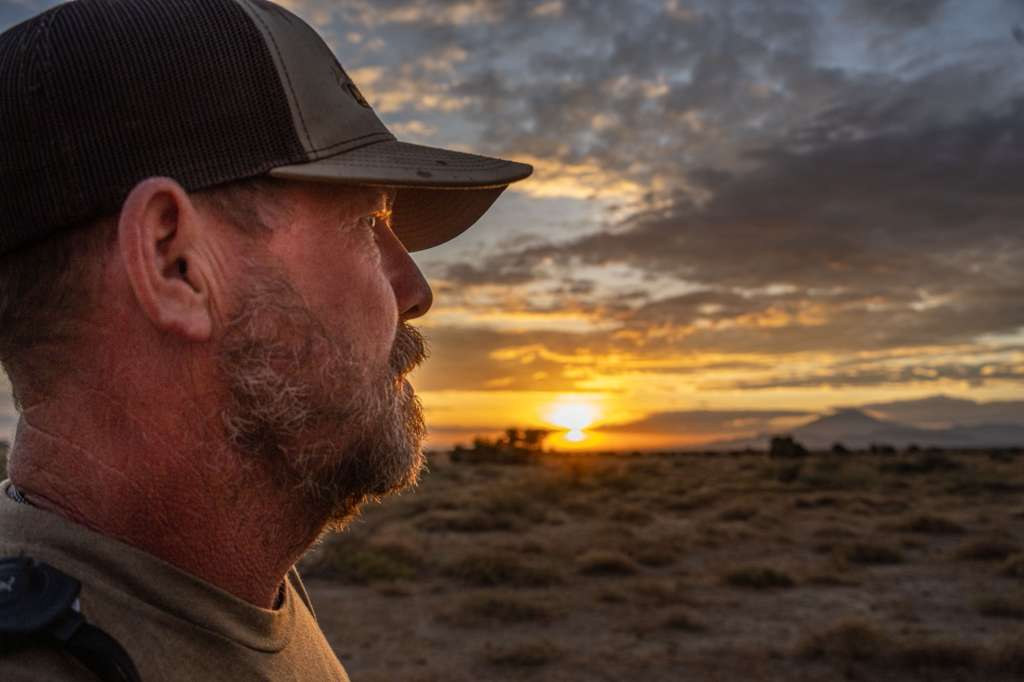 Robert Beall in profile against a Kalahari sunset