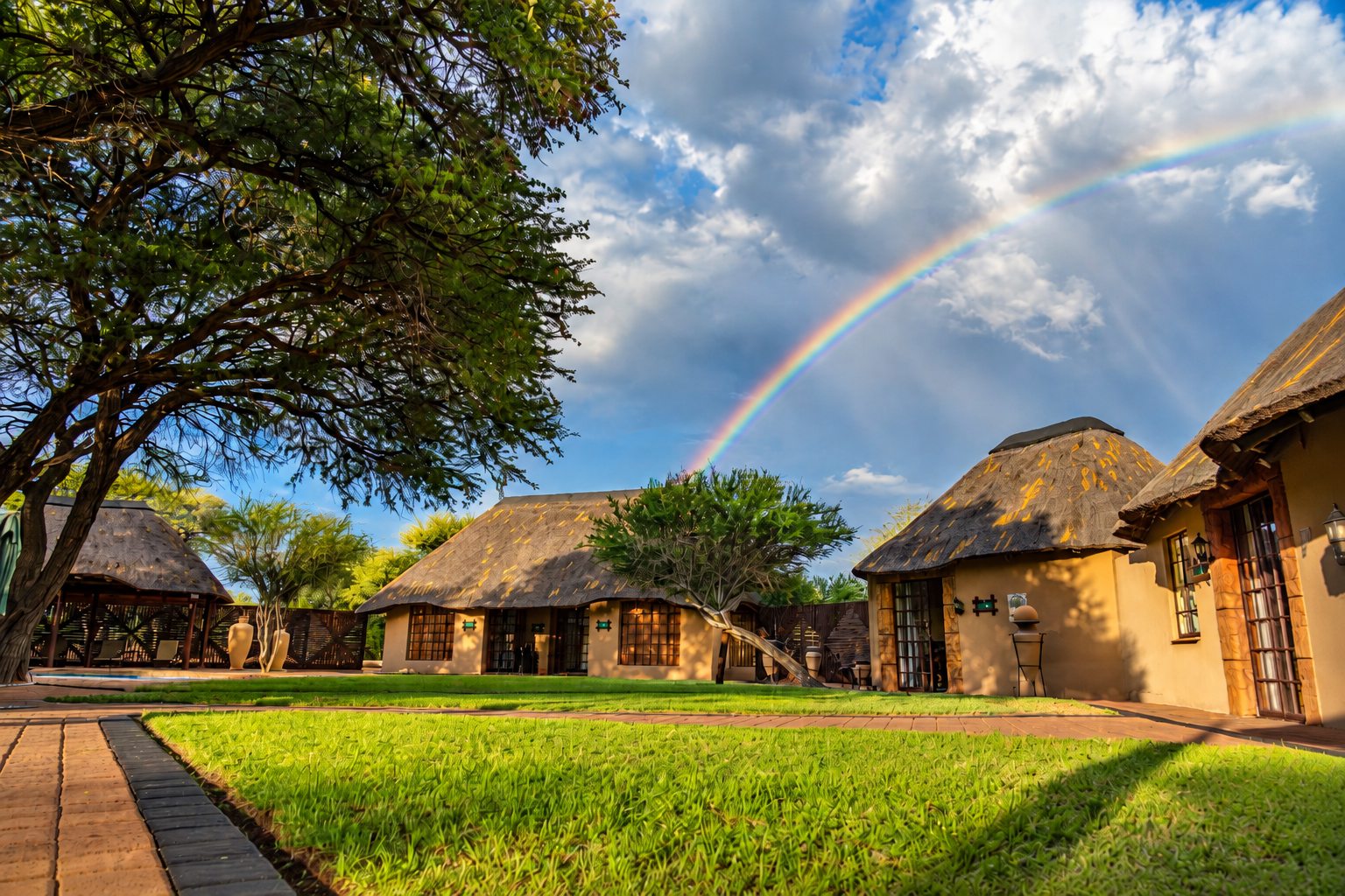 Lodge chalets and lawn after the rain